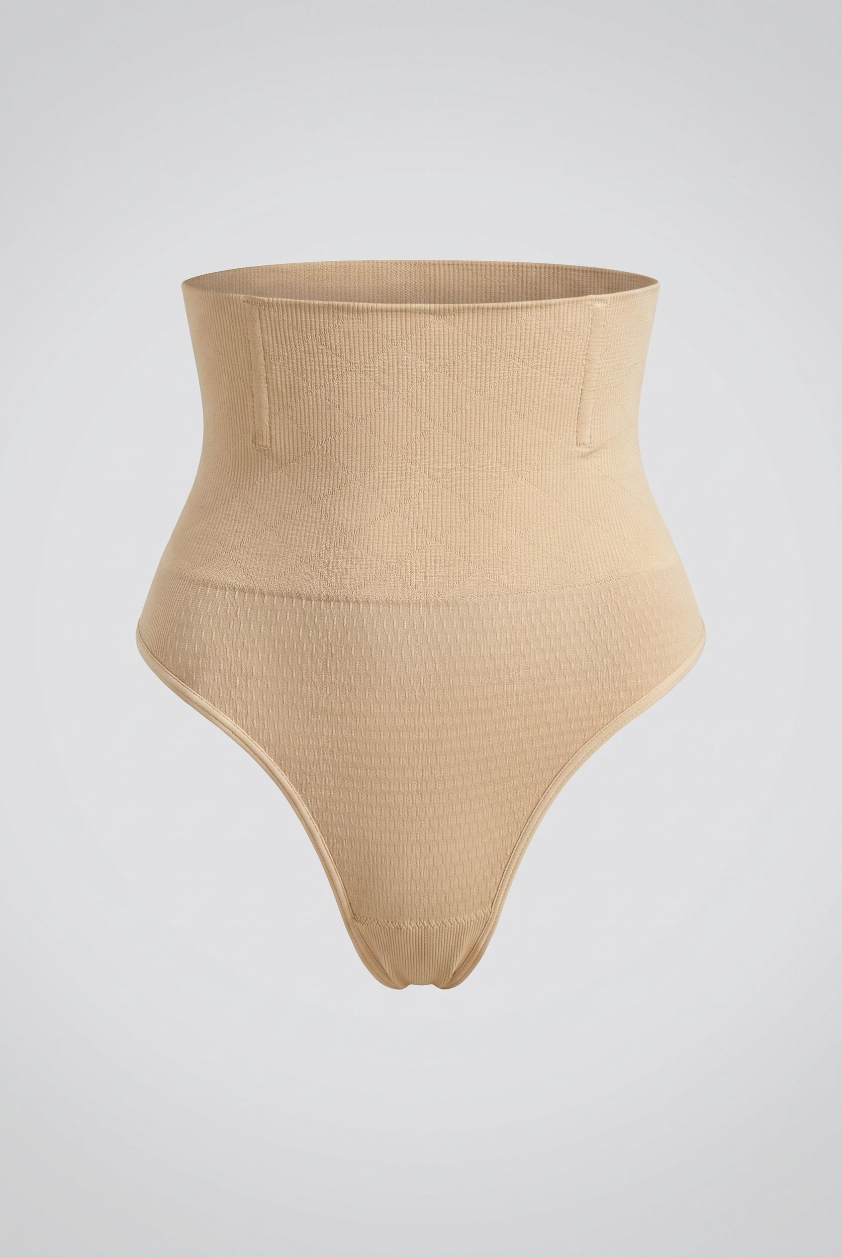 Beige high-waisted shapewear bottom on a light gray background