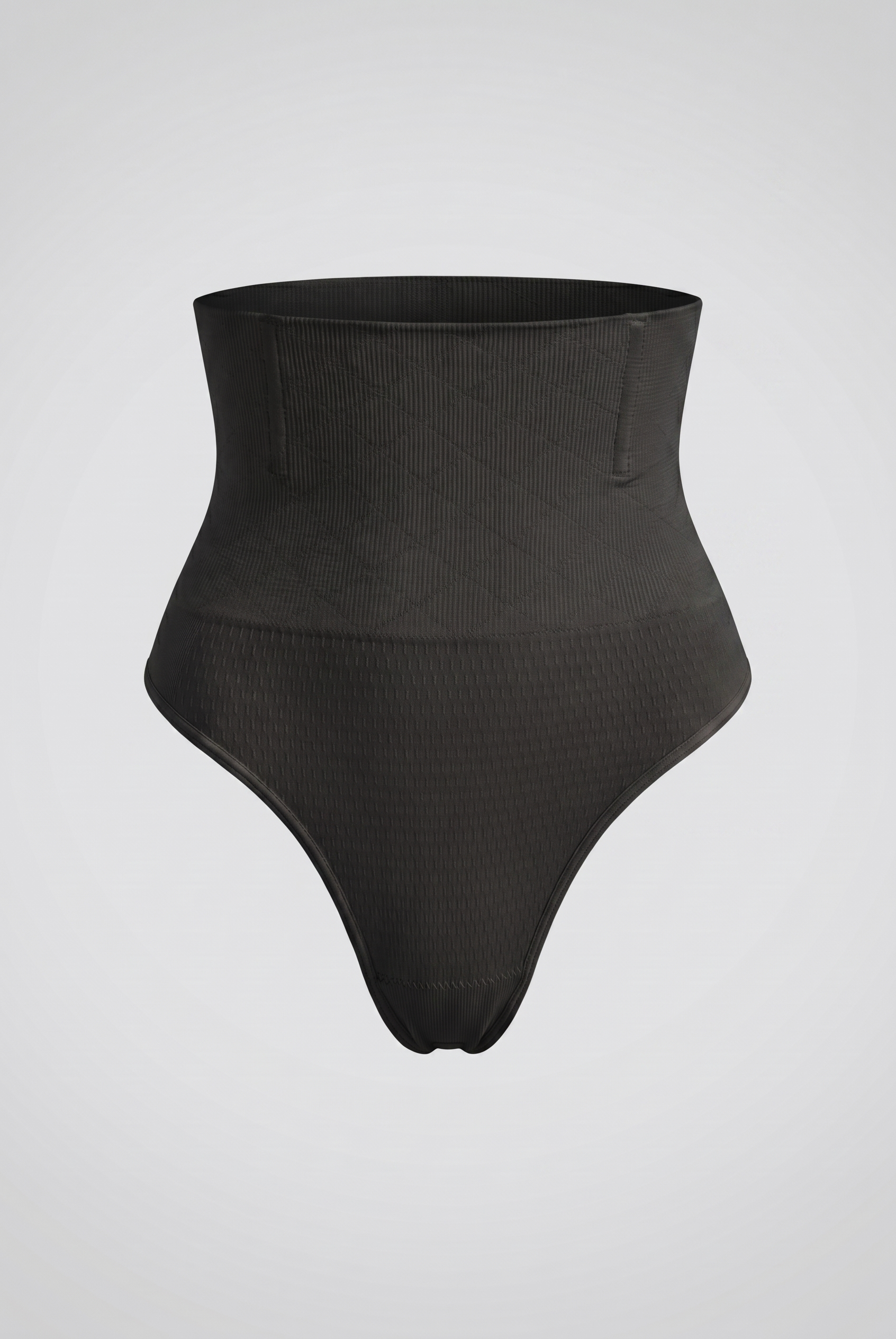 Black high-waisted shapewear on a light gray background