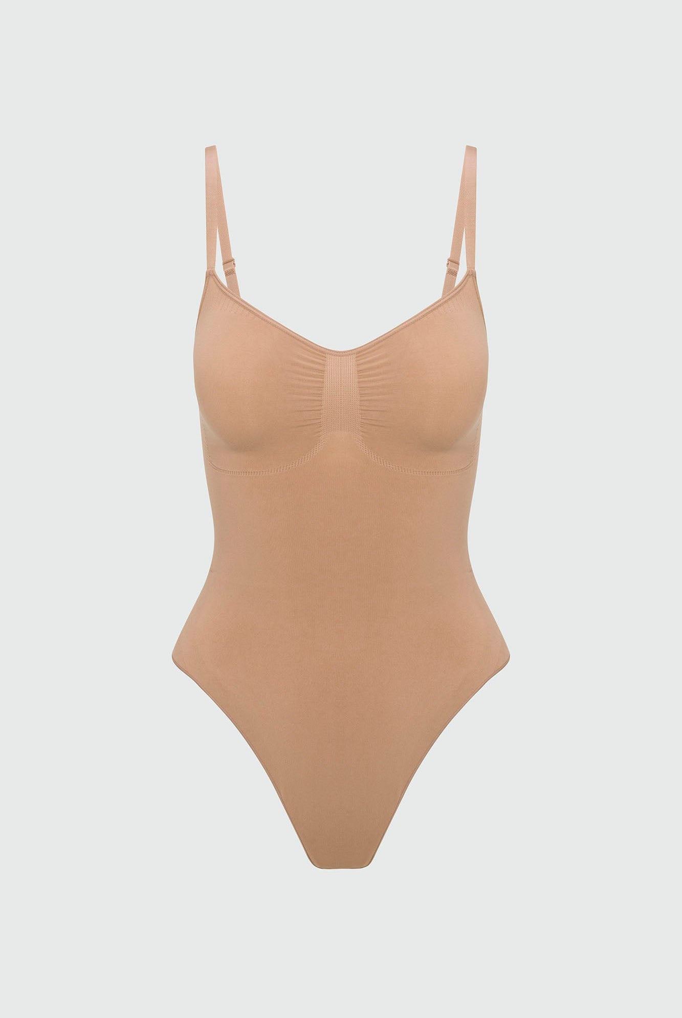 Beige shapewear bodysuit on a light gray background