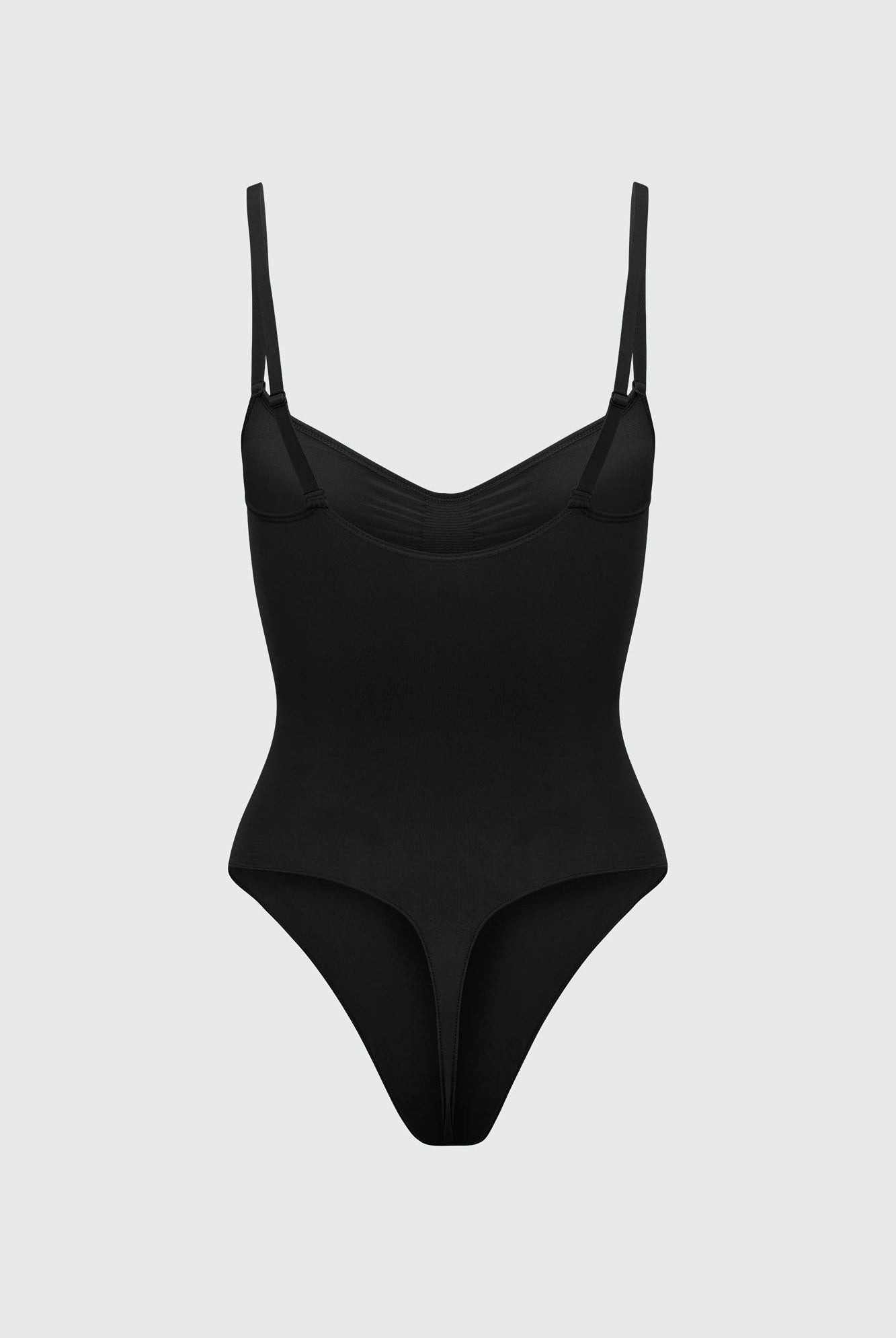 Black bodyshaper with thin straps on a light gray background