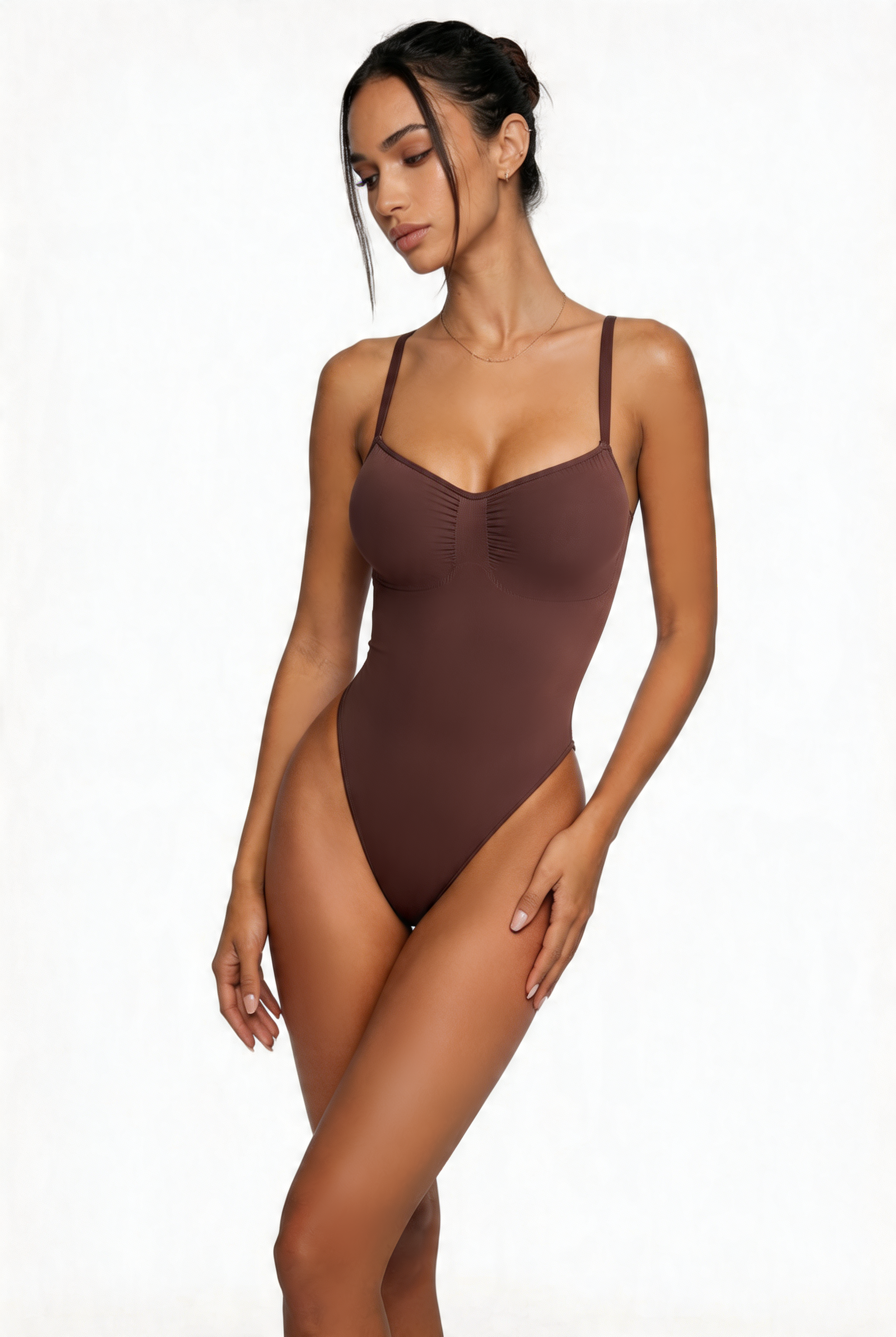 Woman wearing a brown bodyshaper on a white background