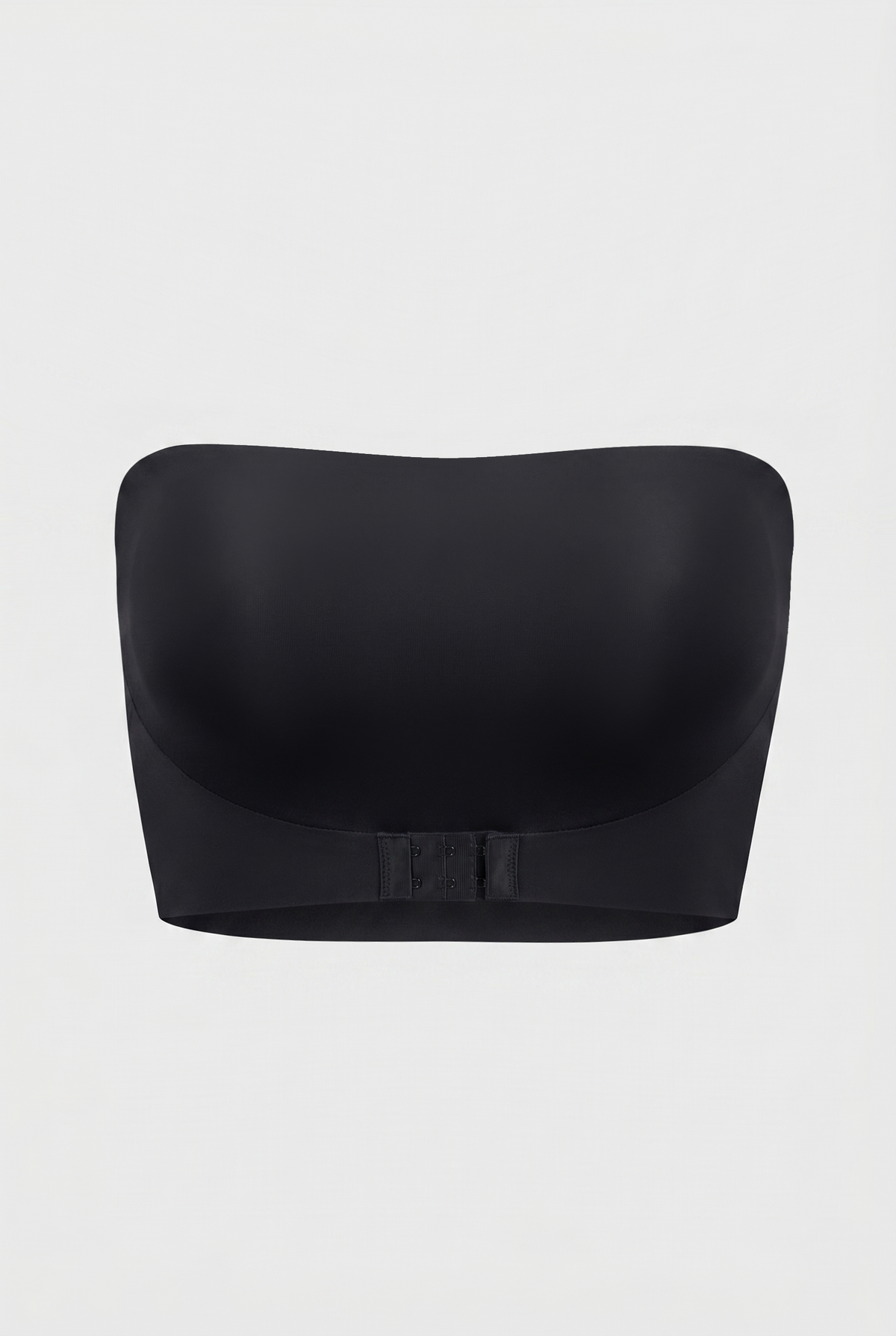 Black strapless bra on a light gray background