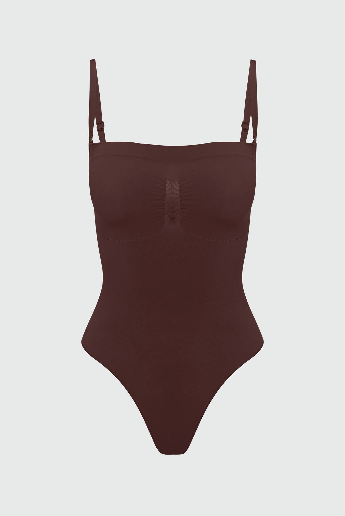 Brown shapewear bodysuit with thin straps on a light gray background