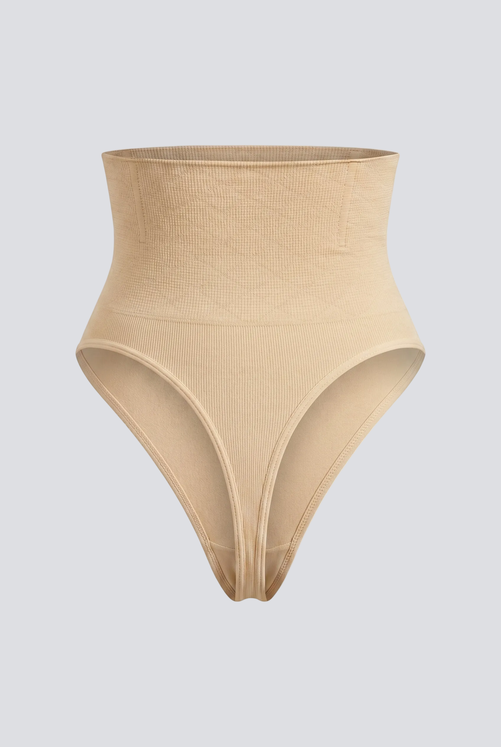 Beige high-waisted shapewear bottom on a light gray background