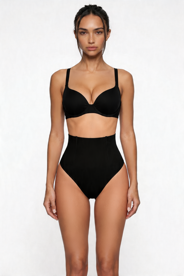 Woman wearing a black shapewear set on a white background