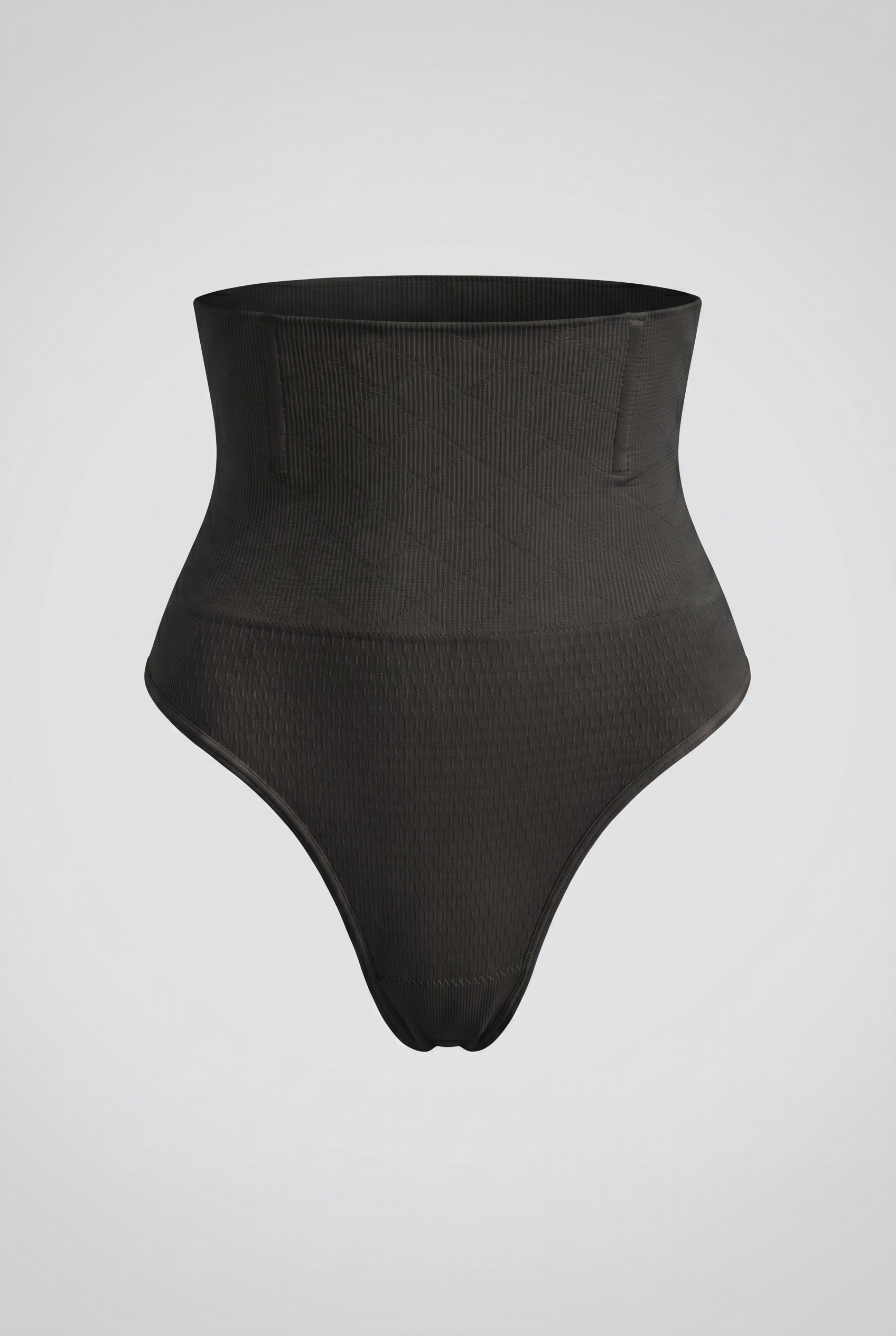Black high-waisted shapewear on a light gray background