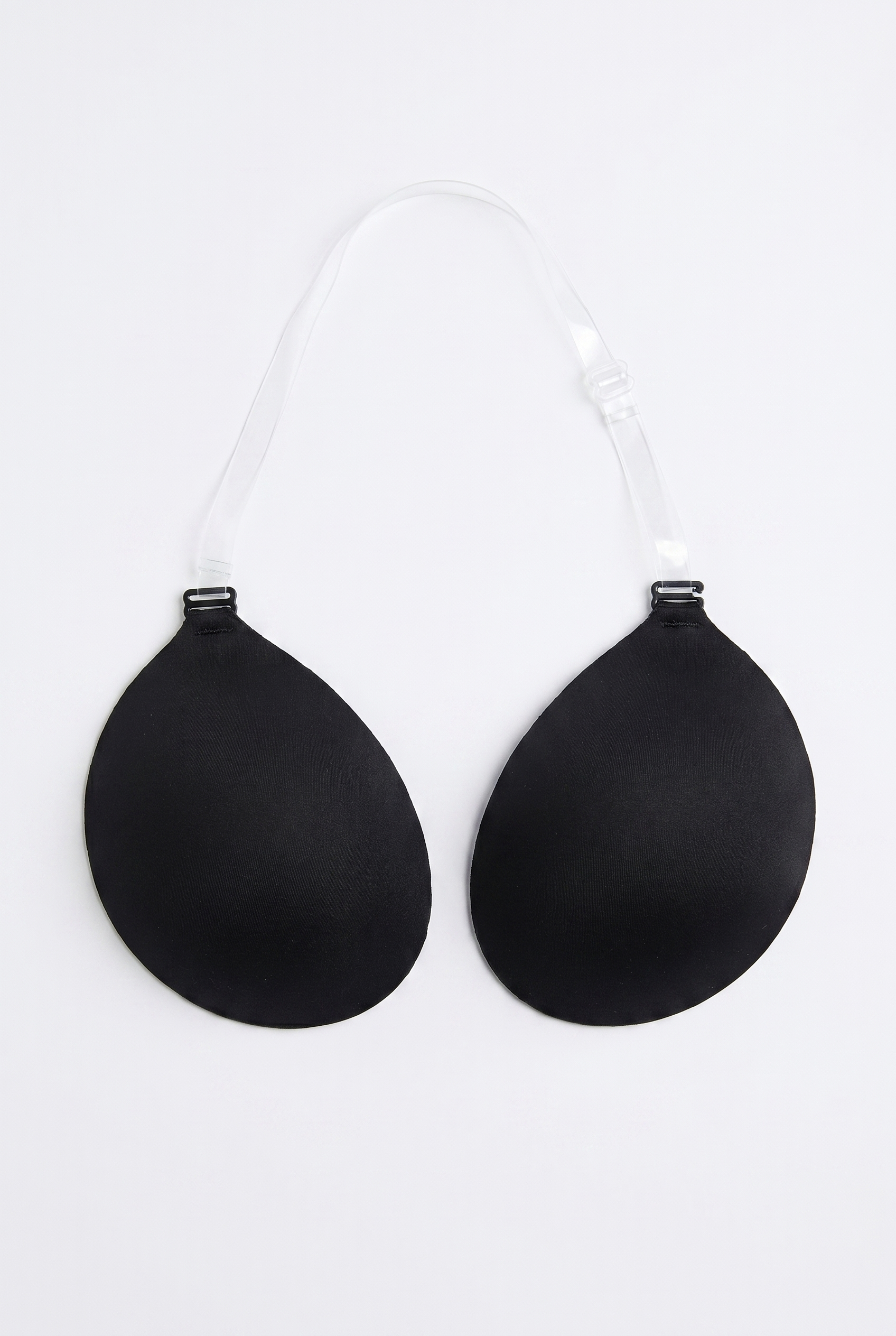 Black bra cups on a white background