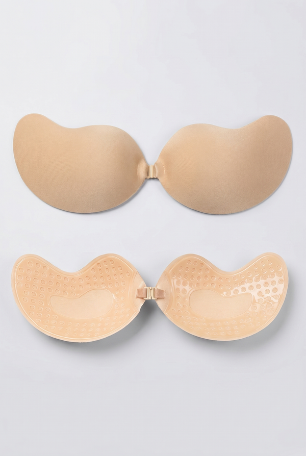 Beige adhesive bra on a light gray background