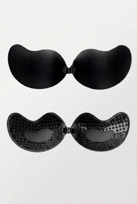 Black adhesive bra pads on a white background