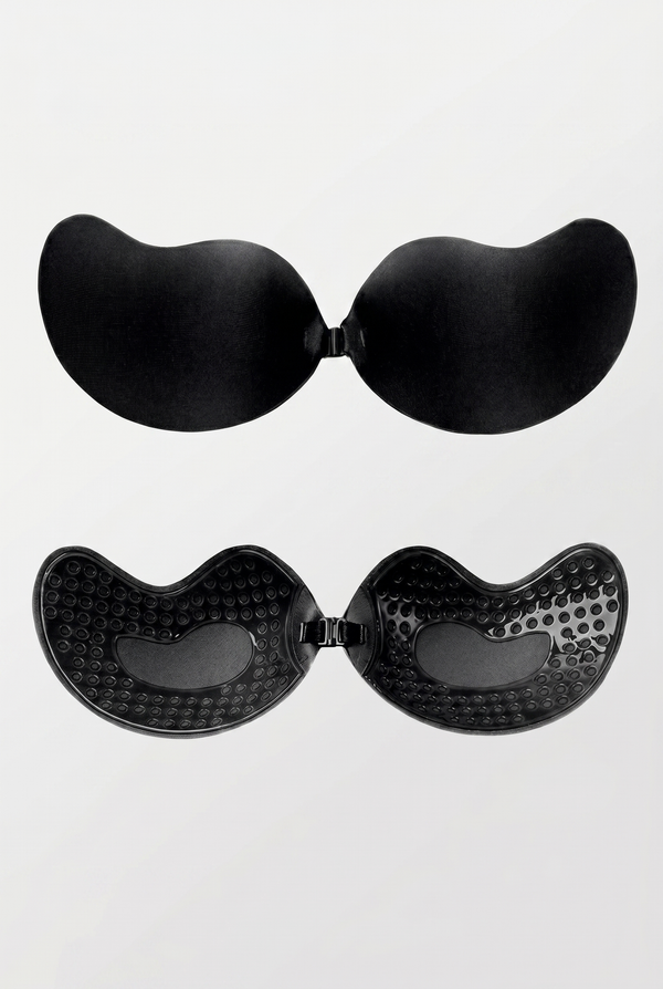Black adhesive bra pads on a white background