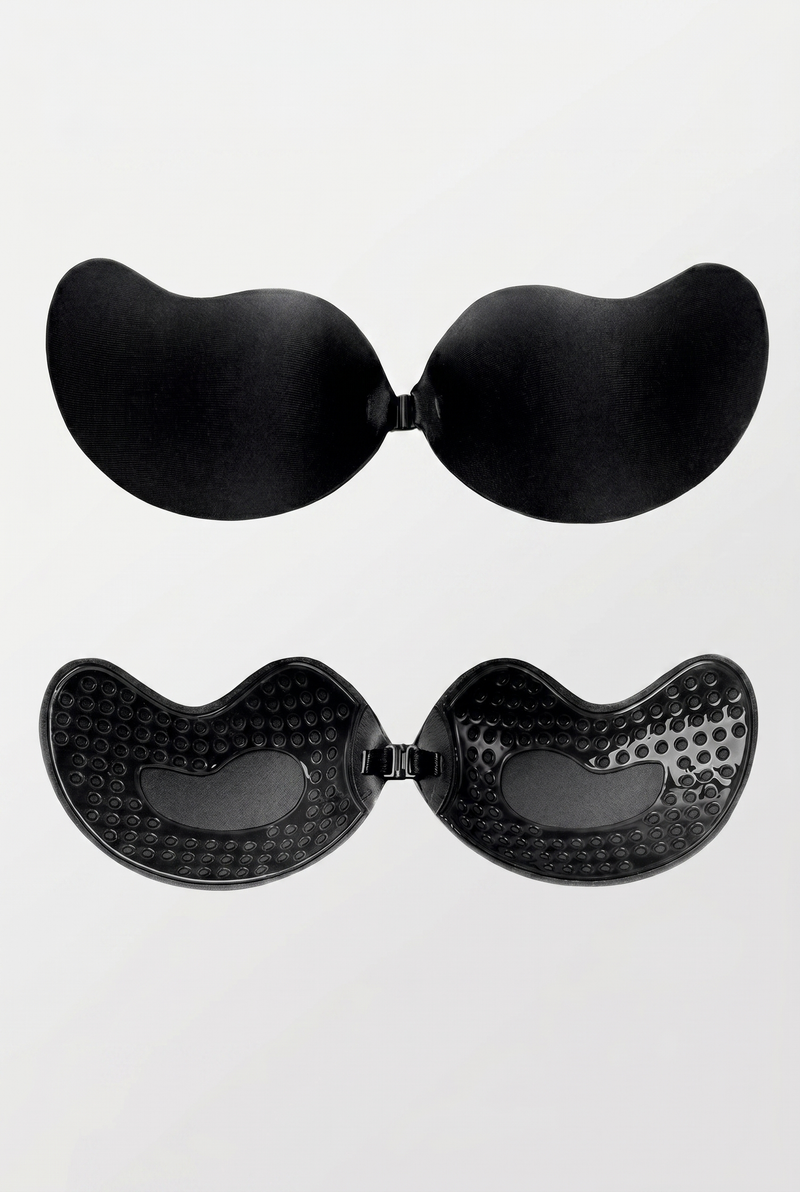 Black adhesive bra pads on a white background