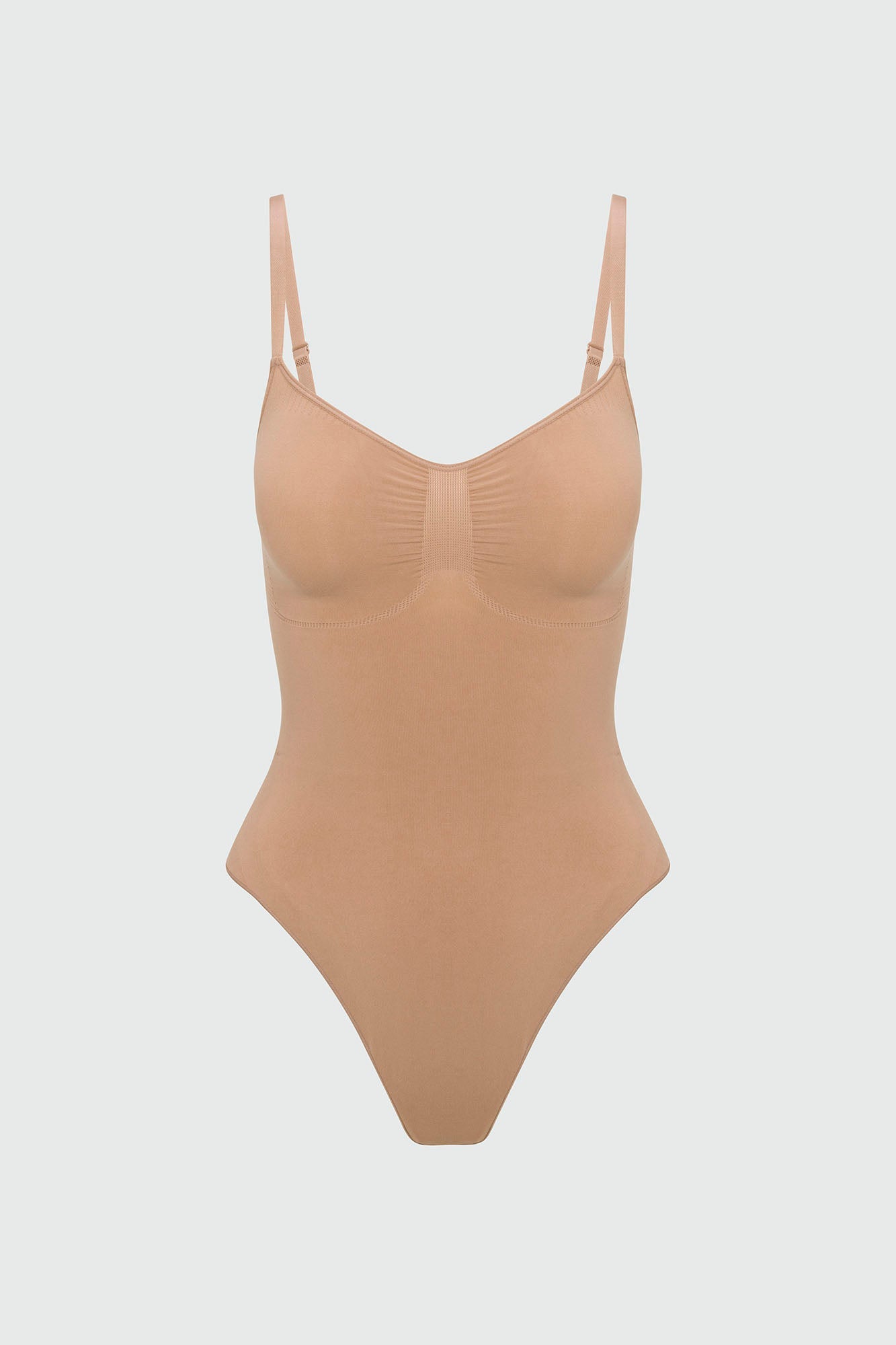 Beige shapewear bodysuit on a light gray background