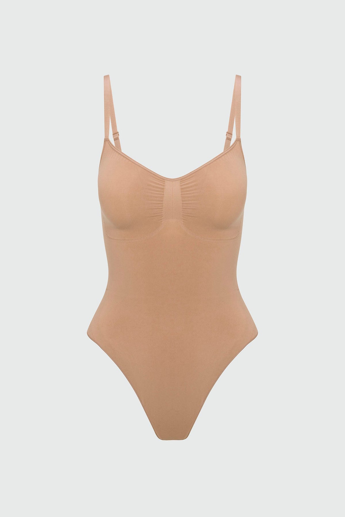 Beige shapewear bodysuit on a light gray background