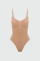 Beige shapewear bodysuit on a light gray background