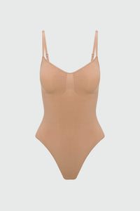 Beige shapewear bodysuit on a light gray background