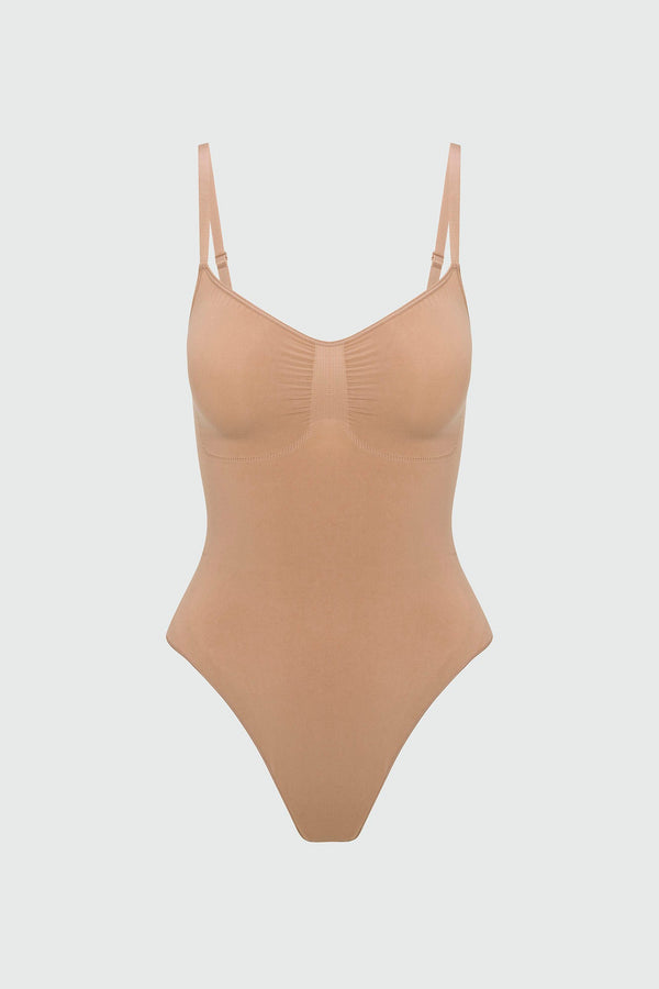 Beige shapewear bodysuit on a light gray background