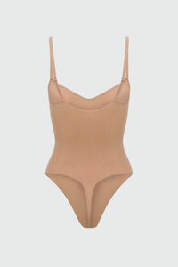 Beige shapewear bodysuit with thin straps on a light gray background