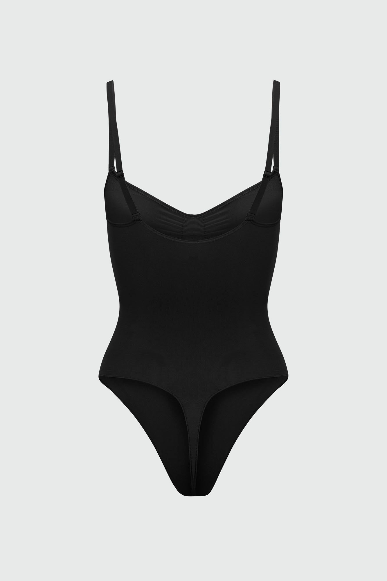 Black bodyshaper with thin straps on a light gray background