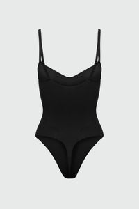 Black bodyshaper with thin straps on a light gray background
