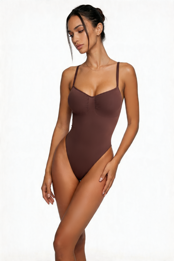 Woman wearing a brown bodyshaper on a white background