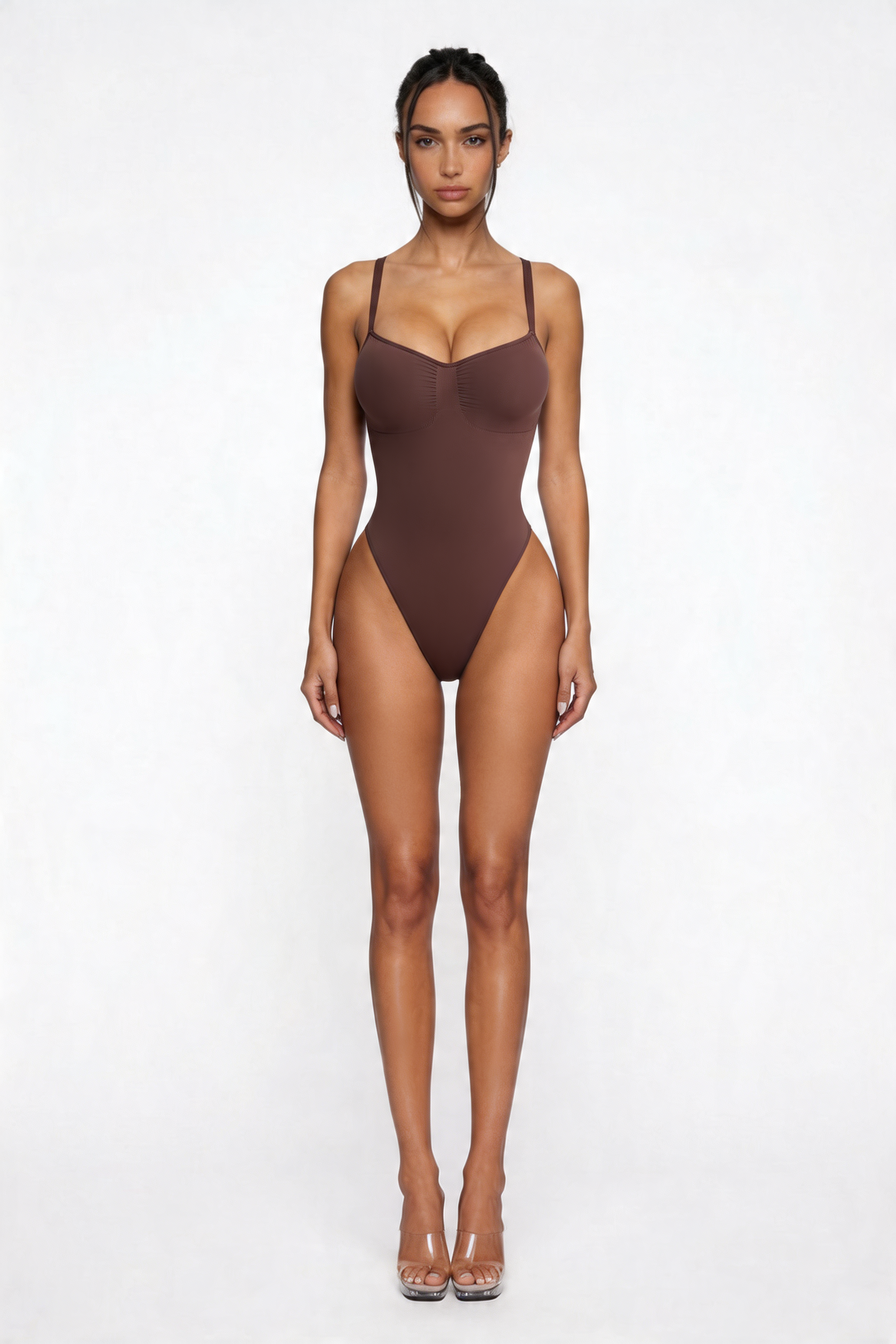 Woman wearing a brown bodyshaper on a white background