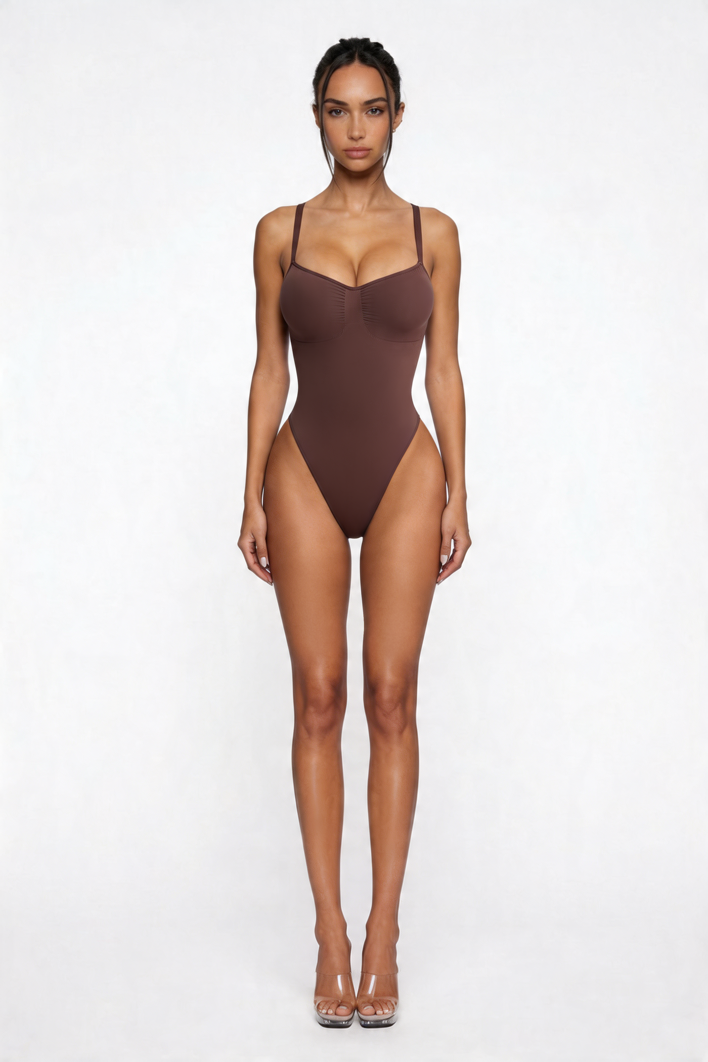 Woman wearing a brown bodyshaper on a white background