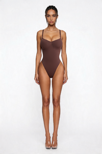 Woman wearing a brown bodyshaper on a white background