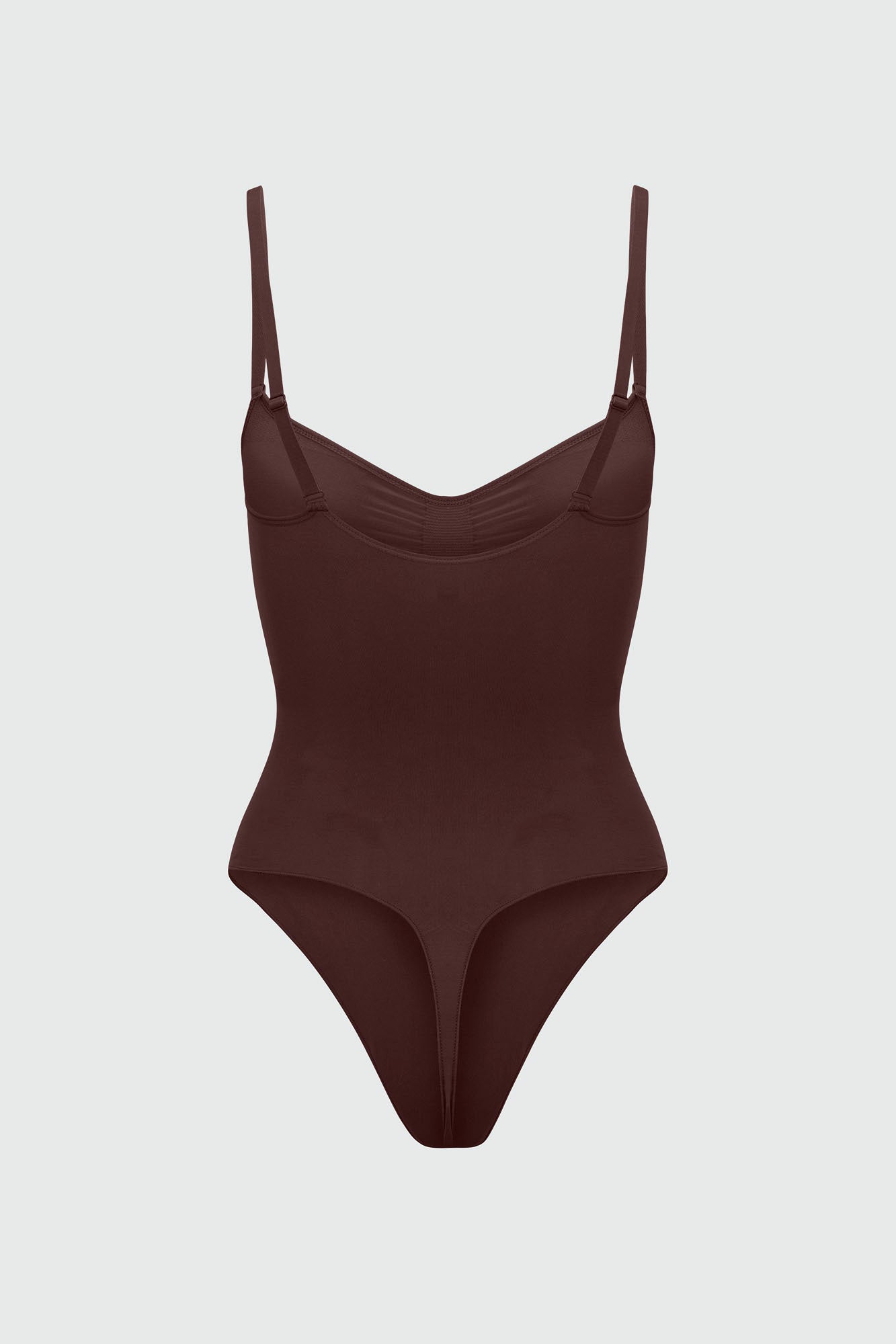 Brown bodyshaper with thin straps on a light gray background