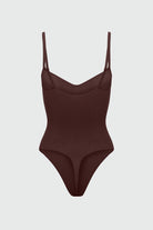 Brown bodyshaper with thin straps on a light gray background