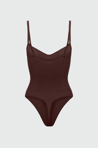 Brown bodyshaper with thin straps on a light gray background