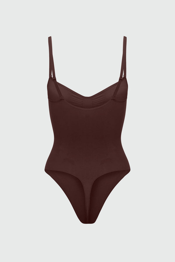 Brown bodyshaper with thin straps on a light gray background