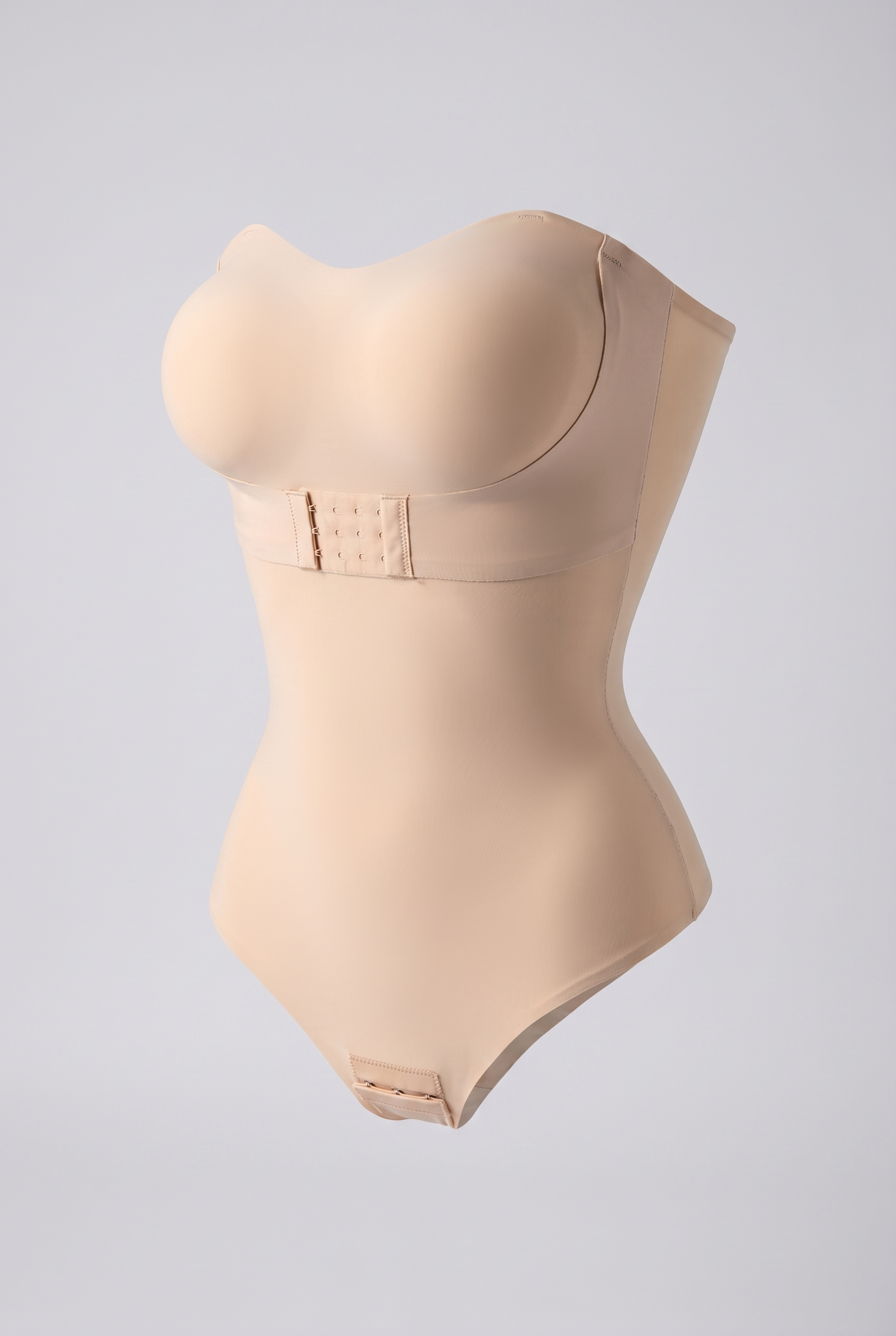 Beige shapewear bodysuit on a light gray background