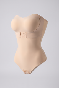 Beige shapewear bodysuit on a light gray background