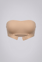 Beige strapless shapewear bra on a light gray background