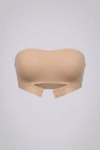 Beige strapless shapewear bra on a light gray background