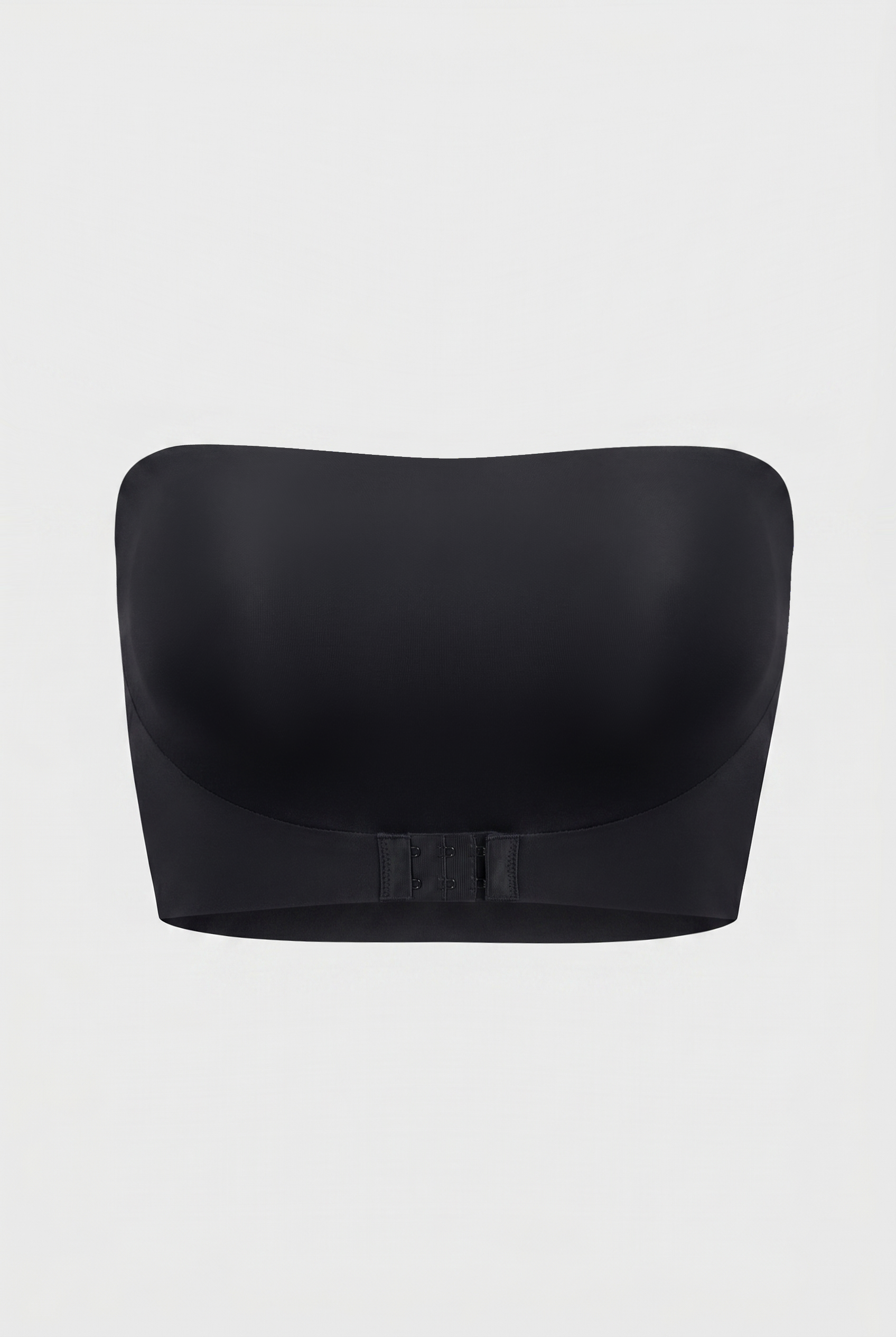 Black strapless bra on a light gray background