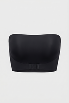 Black strapless bra on a light gray background