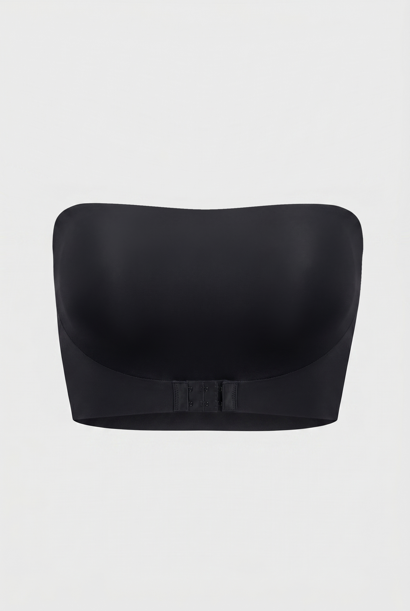 Black strapless bra on a light gray background