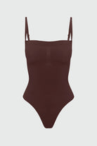 Brown shapewear bodysuit with thin straps on a light gray background