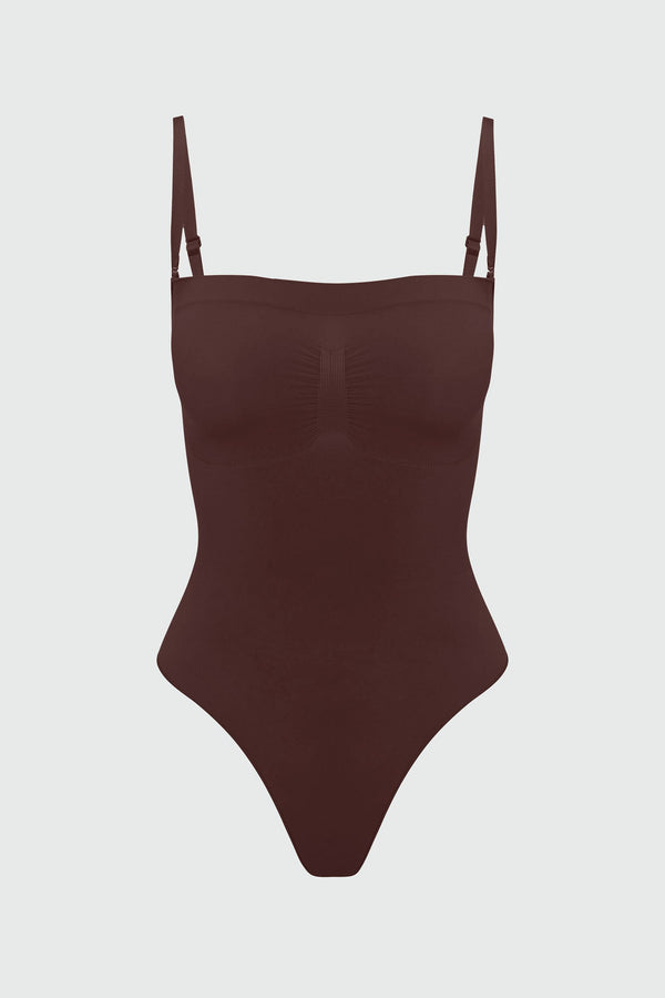Brown shapewear bodysuit with thin straps on a light gray background